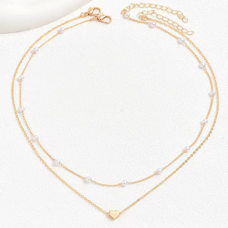 Pearl Harmony: Double Layer Twin Heart Necklace with Special-interest Design