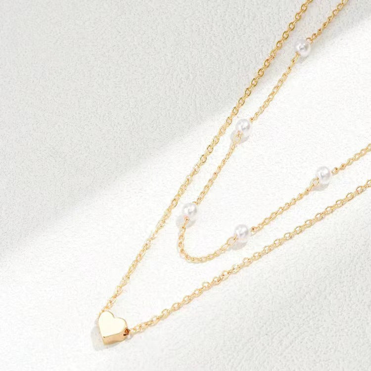 Pearl Harmony: Double Layer Twin Heart Necklace with Special-interest Design