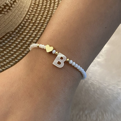 Alphabetical Elegance: White Shell Beaded Bracelet with Metal Love Design for Women