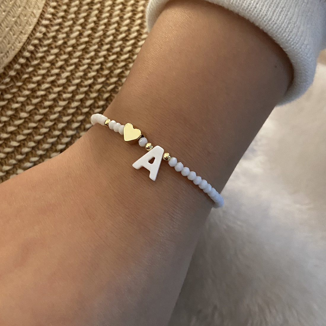 Alphabetical Elegance: White Shell Beaded Bracelet with Metal Love Design for Women