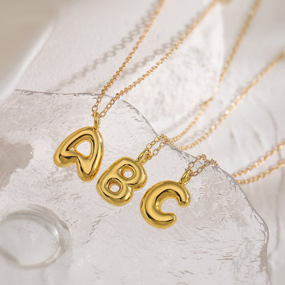 Copper Charisma: A Gilded Alphabet Pendant Necklace